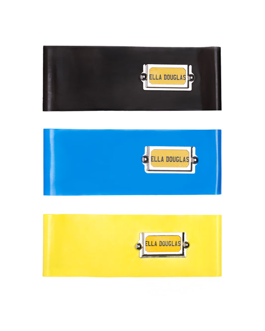 Three Ella Douglas Latex Cabinet Headbands in black, blue and yellow